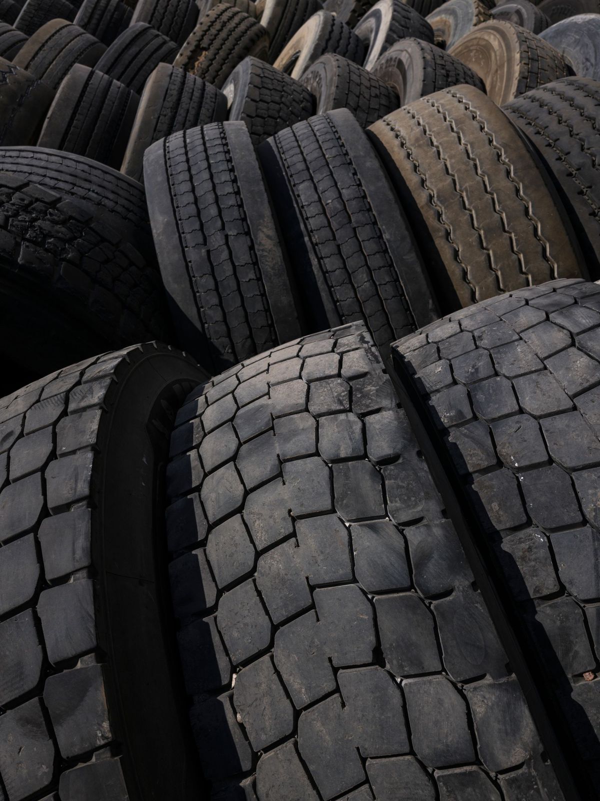 Used tyres piled at a recycling facility